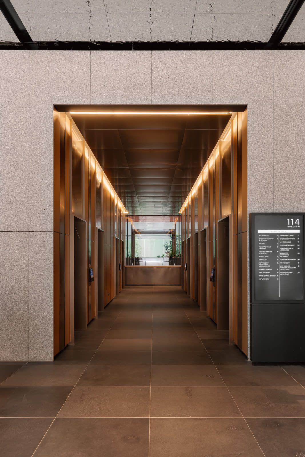 The refinished lift corridor with the 114 directory