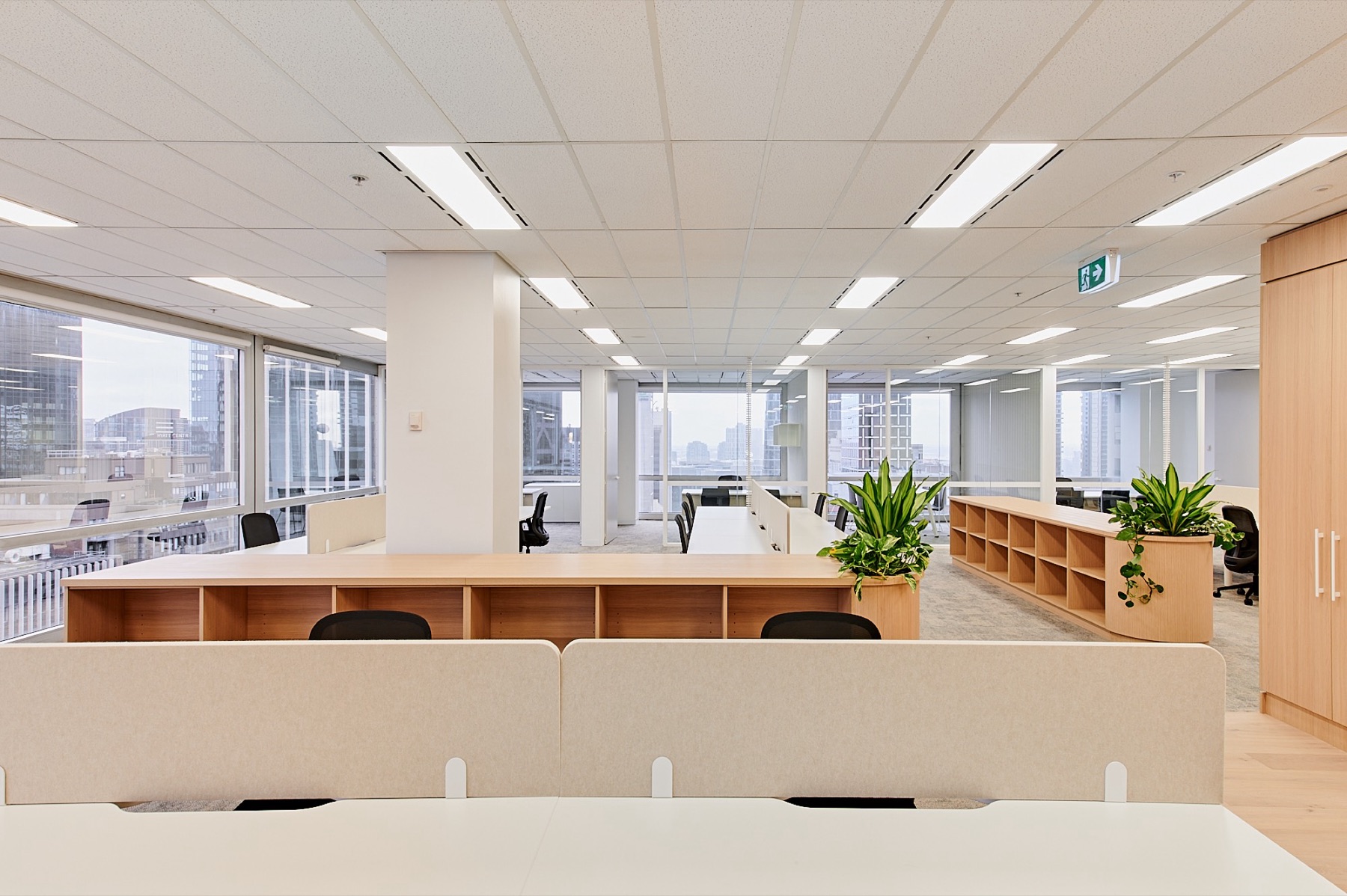 Open plan workspace of the 462.8 sqm suite on Level 19, looking out over the city through the western glazing